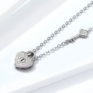 An elegant 925 Sterling Silver heart pendant that is a lock, AAAA CZ's